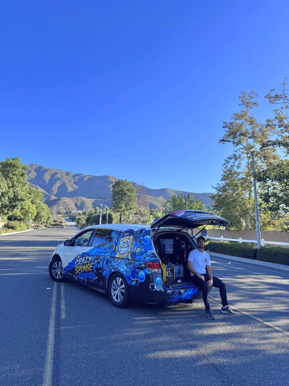 The Crazy Sponge mobile detailing van and technician on-site